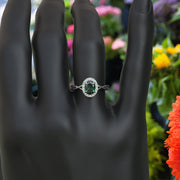 Mystic Green Gleam: Silver Halo Ring Centering Oval Emerald, Enhanced by Twisted Shank Artistry